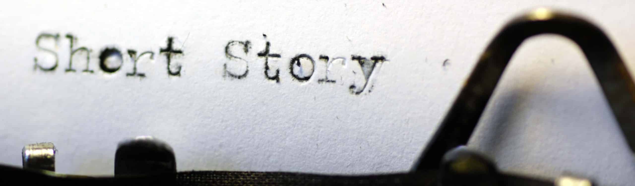 The words 'short story' picked out on a grungy old typewriter. Macro image.