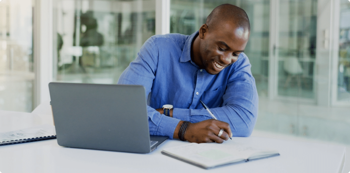 Write, man with writing utensil, paper, packet, and computer